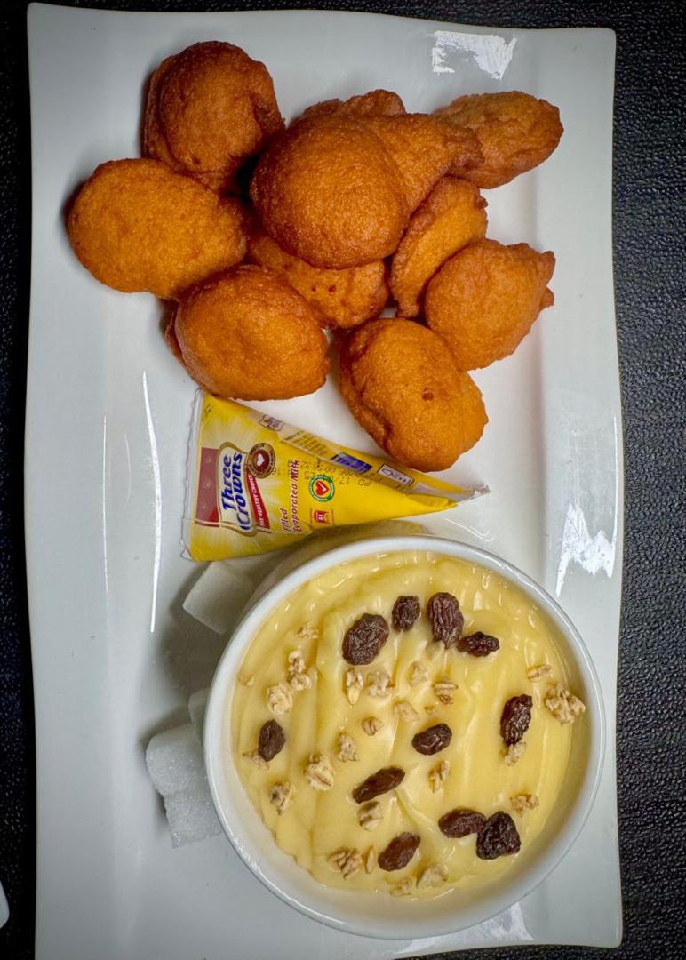 Freshly made puff puff with custard